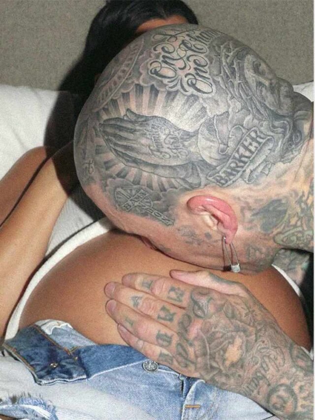 Travis Barker Kisses Pregnant Kourtney Kardashian’s Bare Baby Bump in Sweet Photo